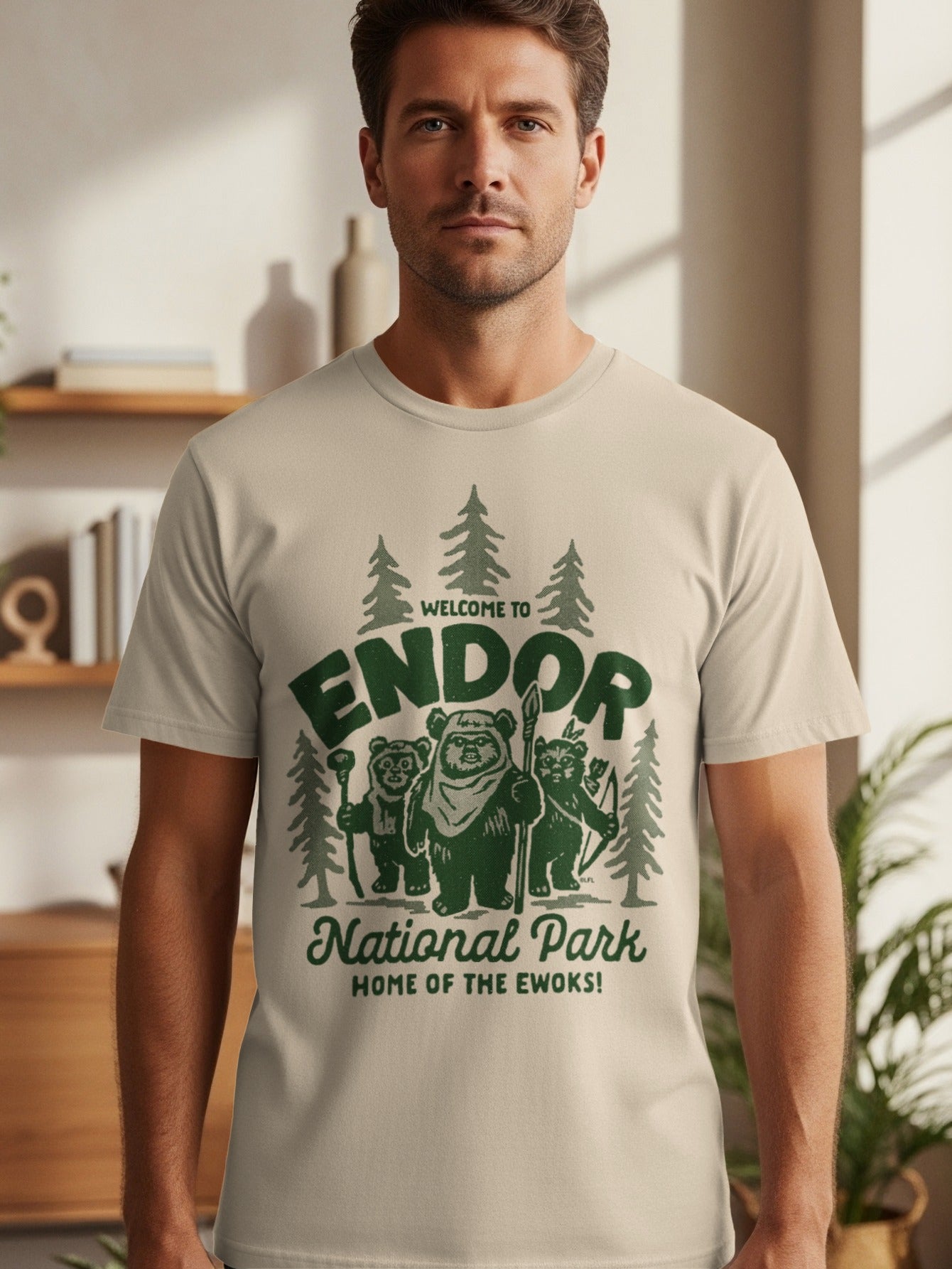 Light tan t-shirt with green "Welcome to Endor National Park Home of the Ewoks!" text and Ewok illustrations.