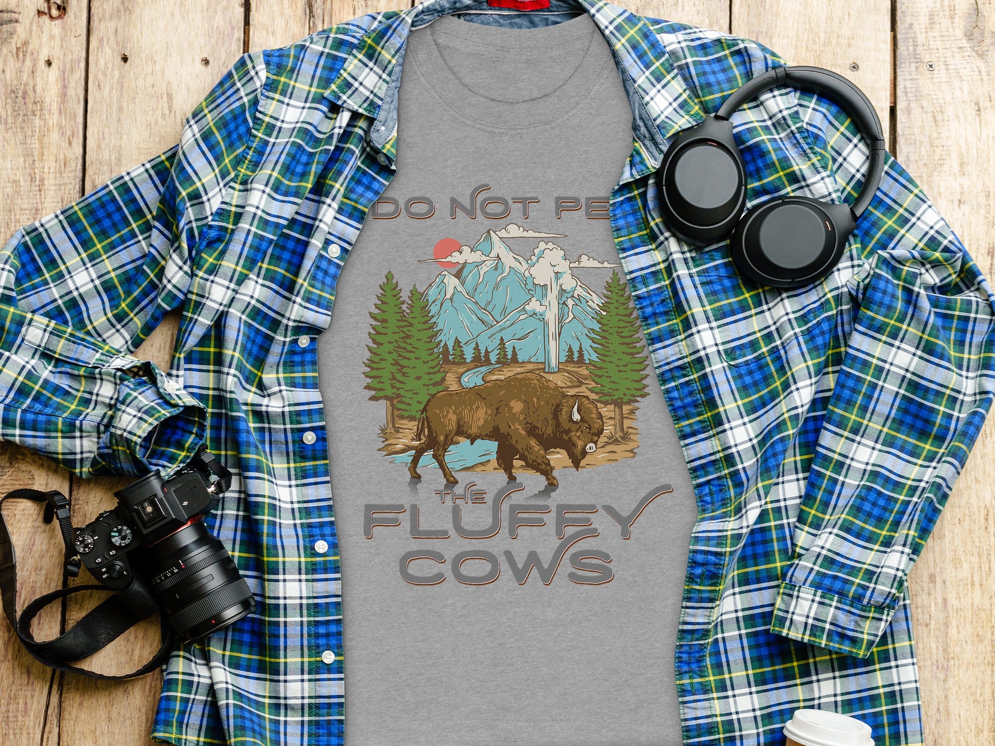 Gray t-shirt with bison, mountains, and text "DO NOT PE" and "THE FLUFFY COWS".