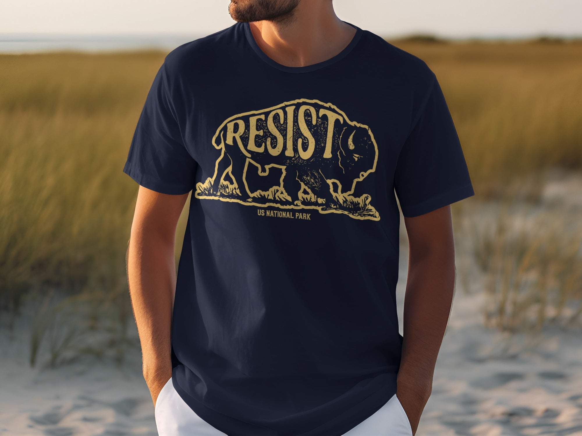 Navy t-shirt with yellow bison graphic and "RESIST" text, "US National Park" below.