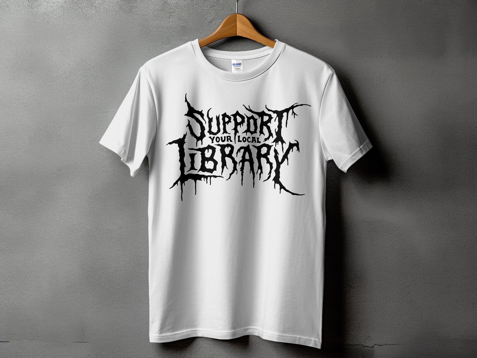 White t-shirt with black "Support Your Local Library" text in gothic, dripping font.
