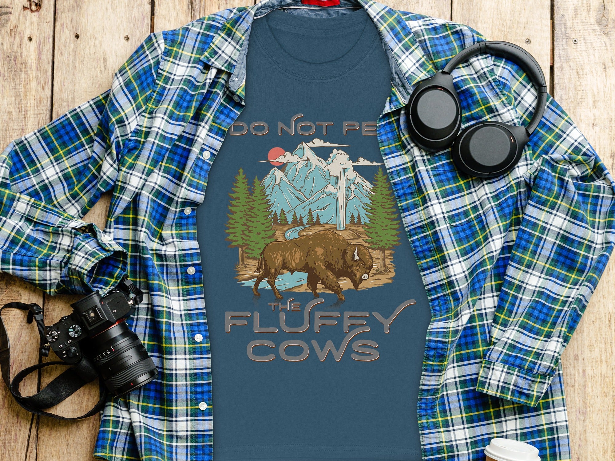 Blue t-shirt with bison, mountains, and text "DO NOT PE THE FLUFFY COWS".