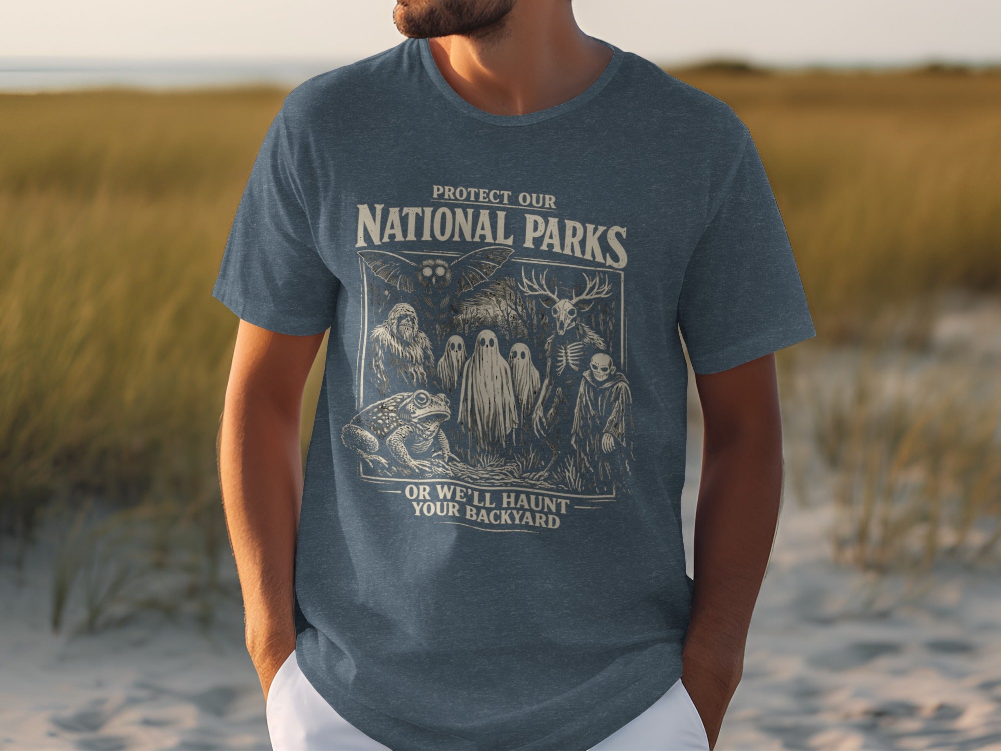 T-shirt with "Protect Our National Parks" and spooky creatures.