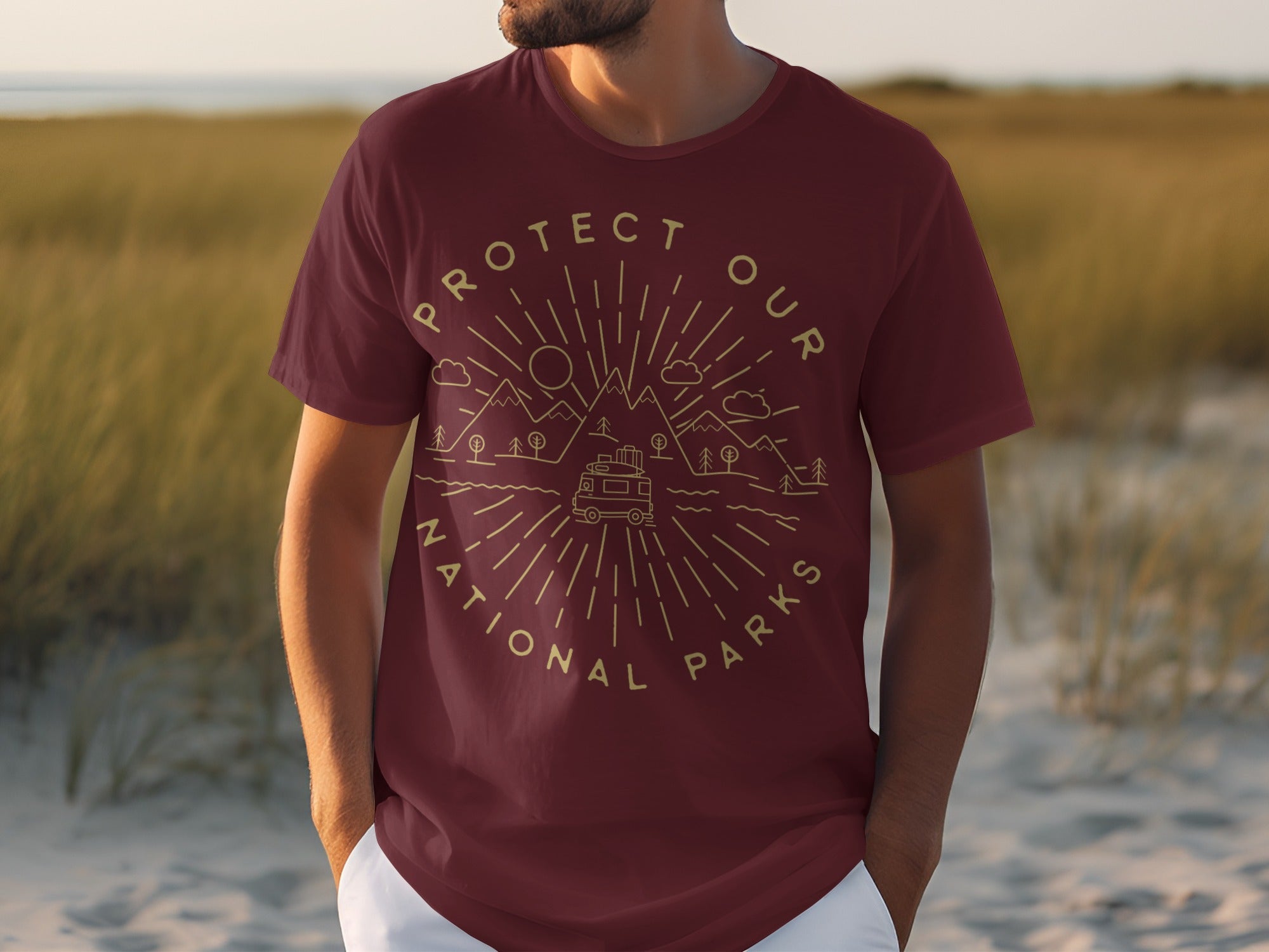 Maroon t-shirt with gold line art of mountains, trees, camper van, and "Protect Our National Parks" text.