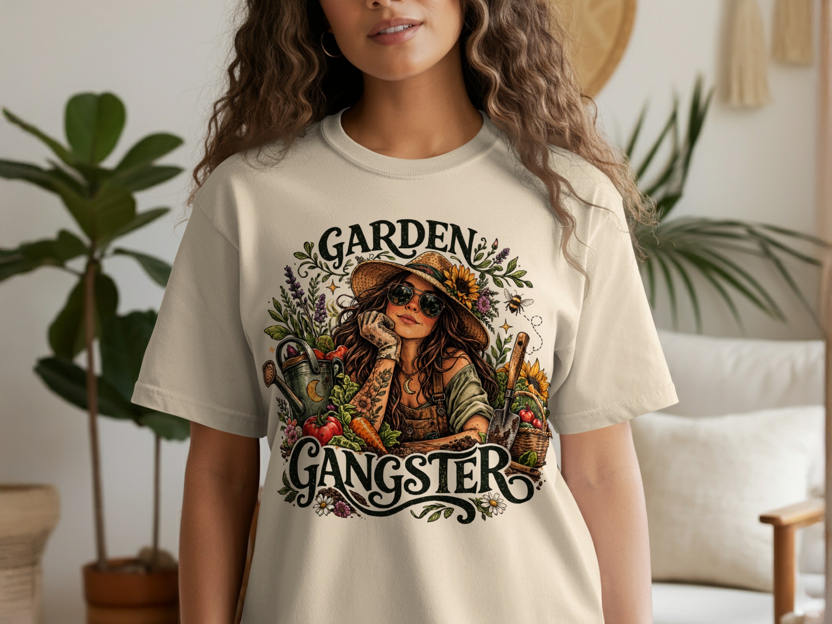 T-shirt graphic with garden theme, reading "Garden Gangster" featuring a woman with sunflowers.