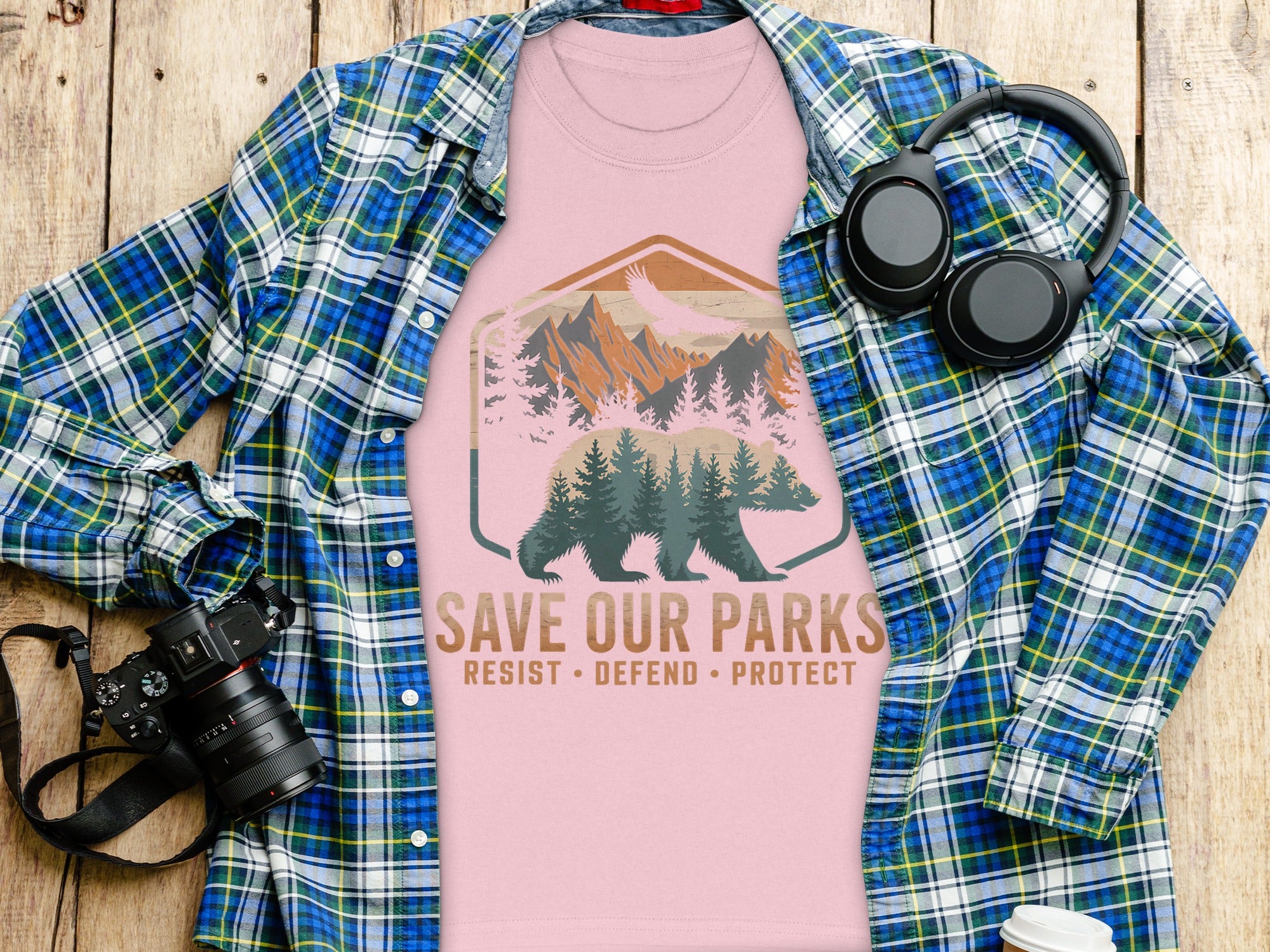 Pink t-shirt with bear, mountain, and eagle graphic, text reads "Save Our Parks".