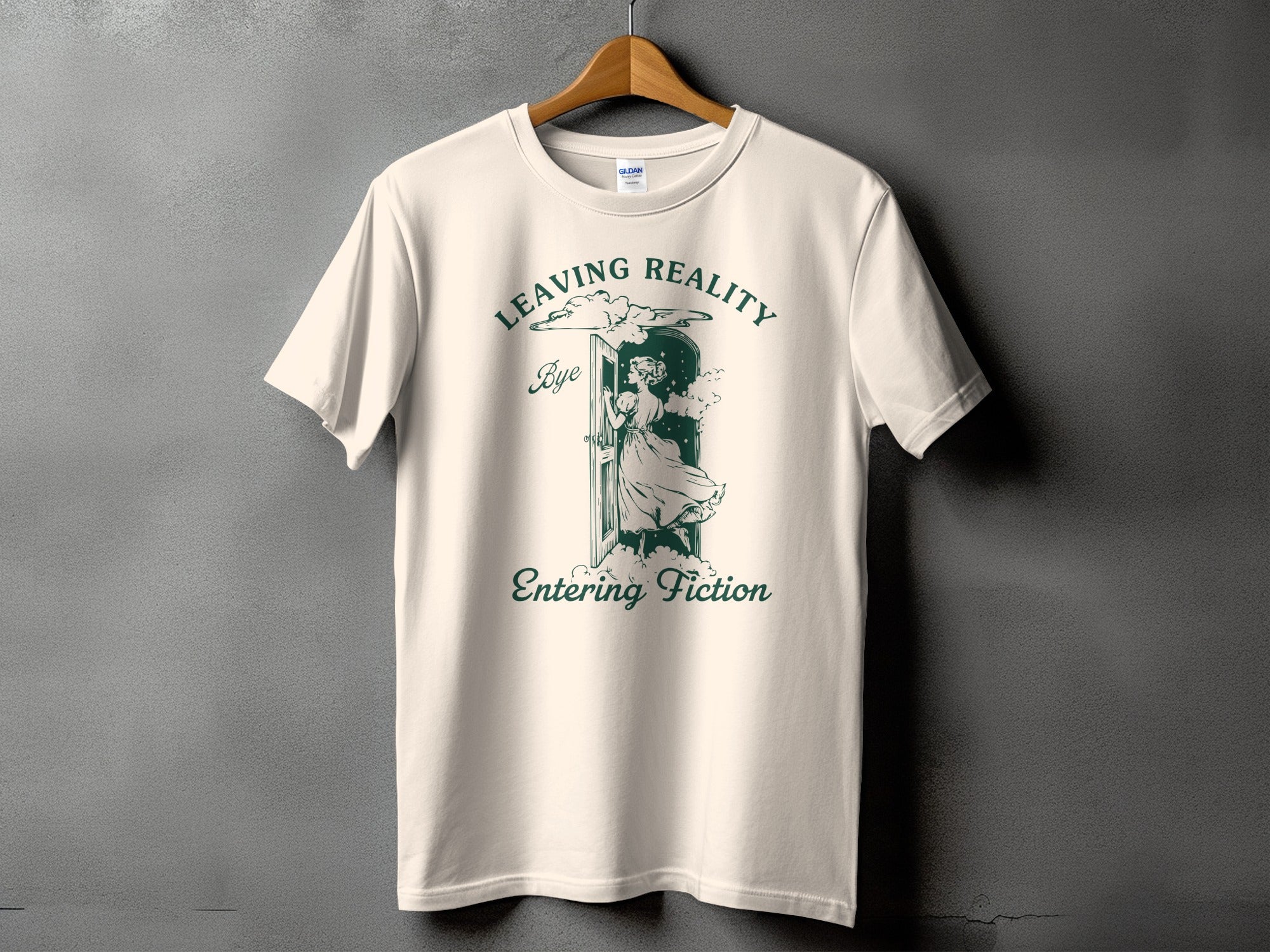 Cream t-shirt with "Leaving Reality" and woman entering door graphic.