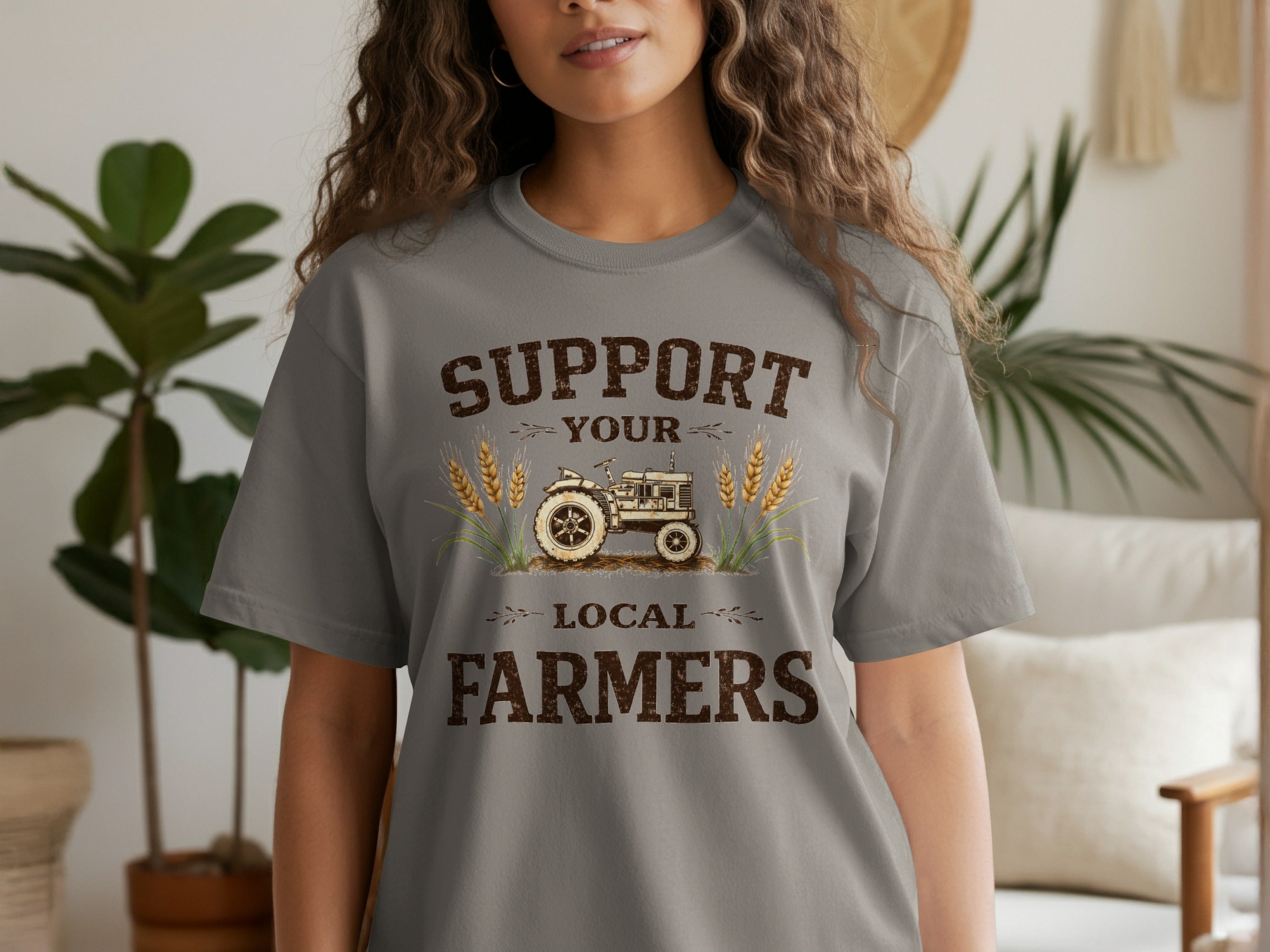 Grey t-shirt with text "SUPPORT YOUR LOCAL FARMERS" and illustration of a tractor.