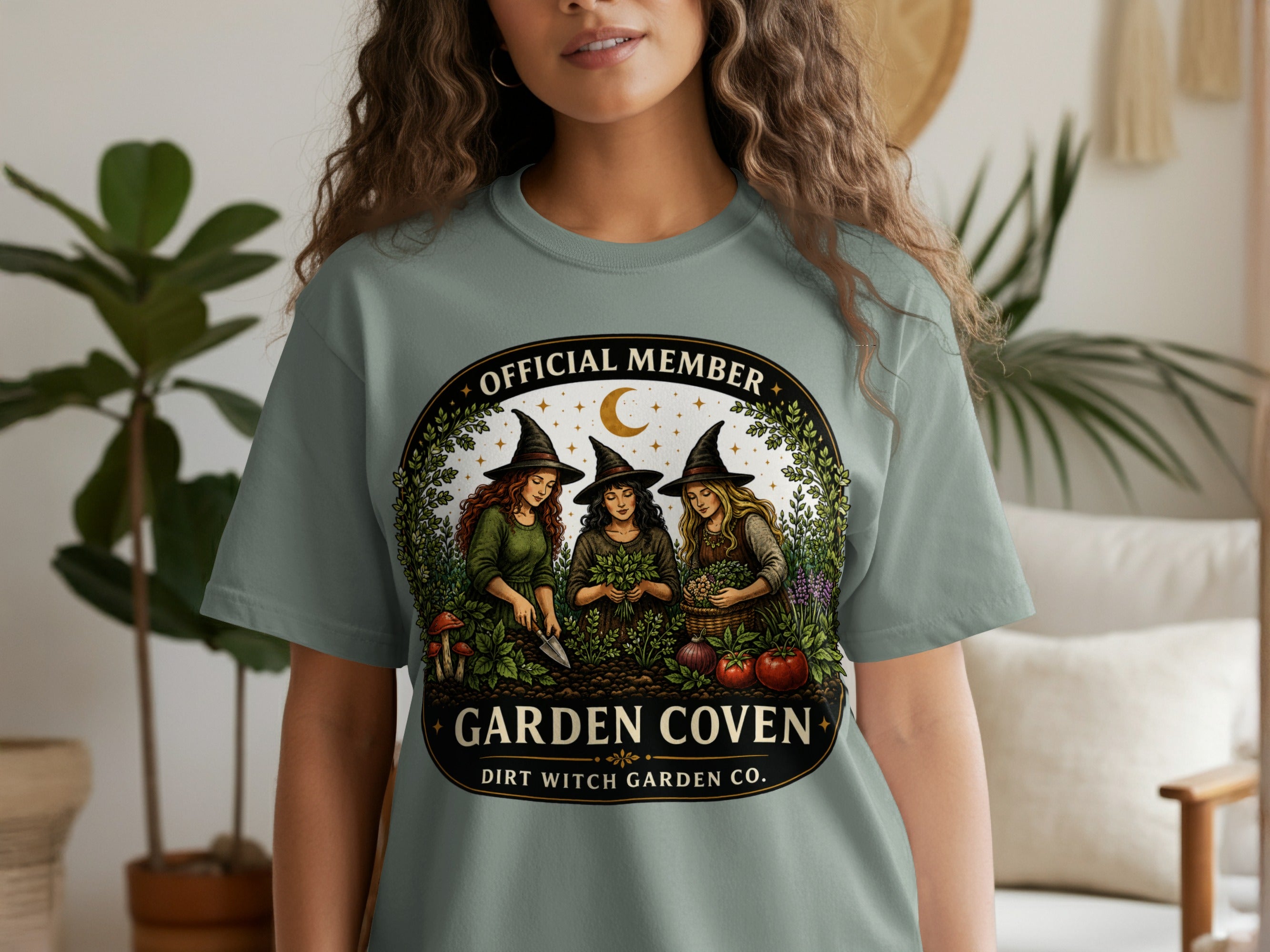 Official Member Garden Coven by Dirt Witch Garden Co. t-shirt with witches gardening.