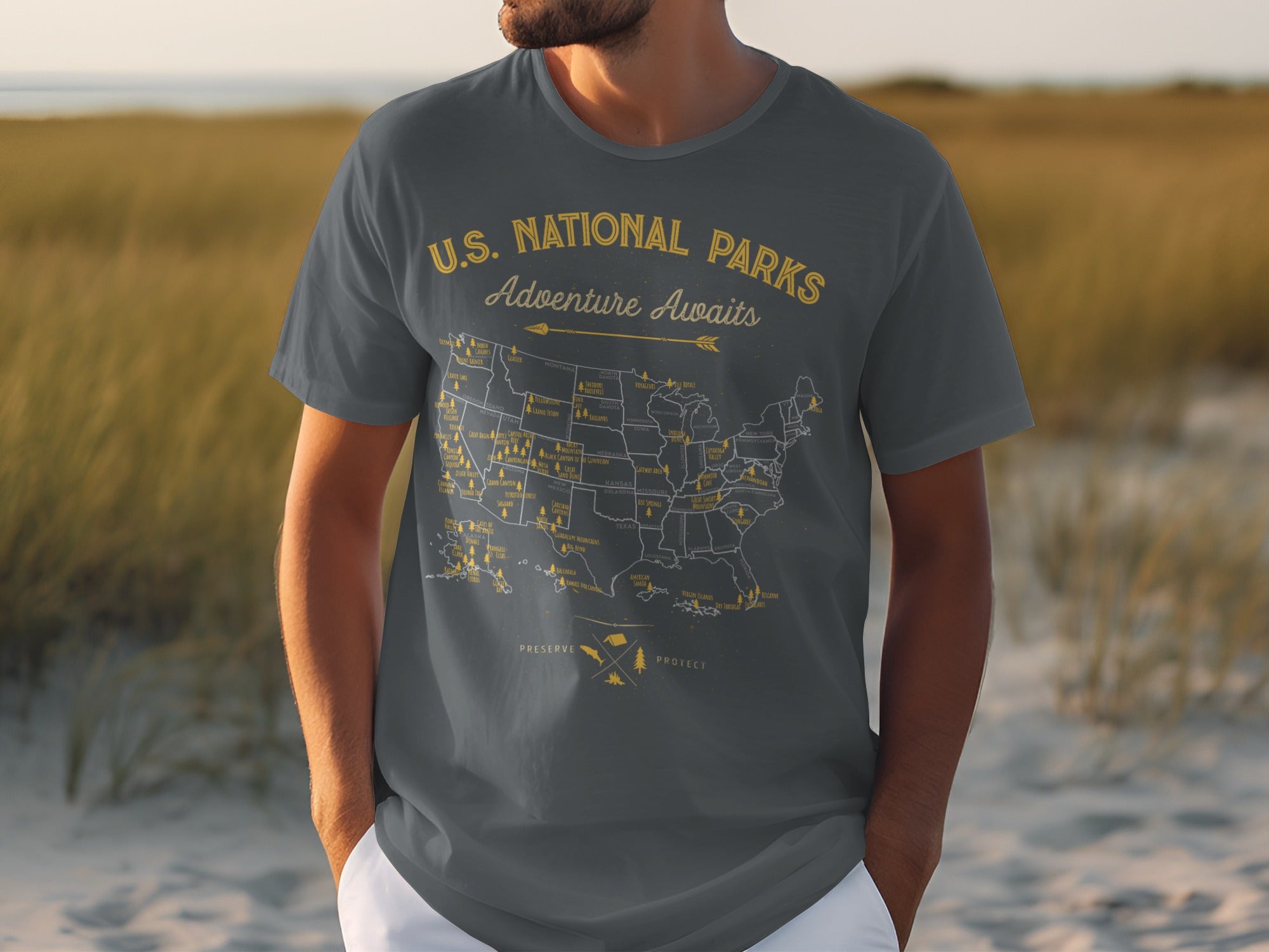 Gray t-shirt with yellow U.S. National Parks map and "Adventure Awaits" text.