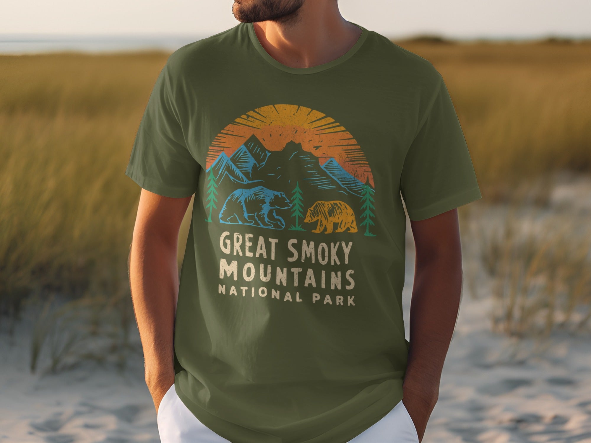 Olive green t-shirt with distressed graphic of bears and mountains, text reads "Great Smoky Mountains National Park".