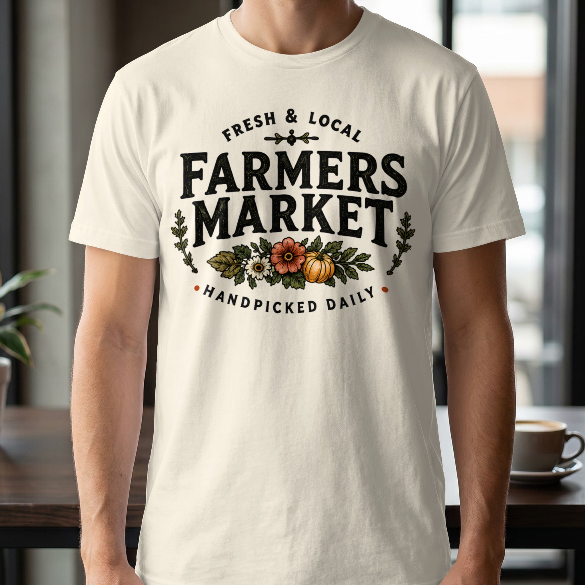 Cream t-shirt with "Fresh & Local Farmers Market Handpicked Daily" text and floral pumpkin design.