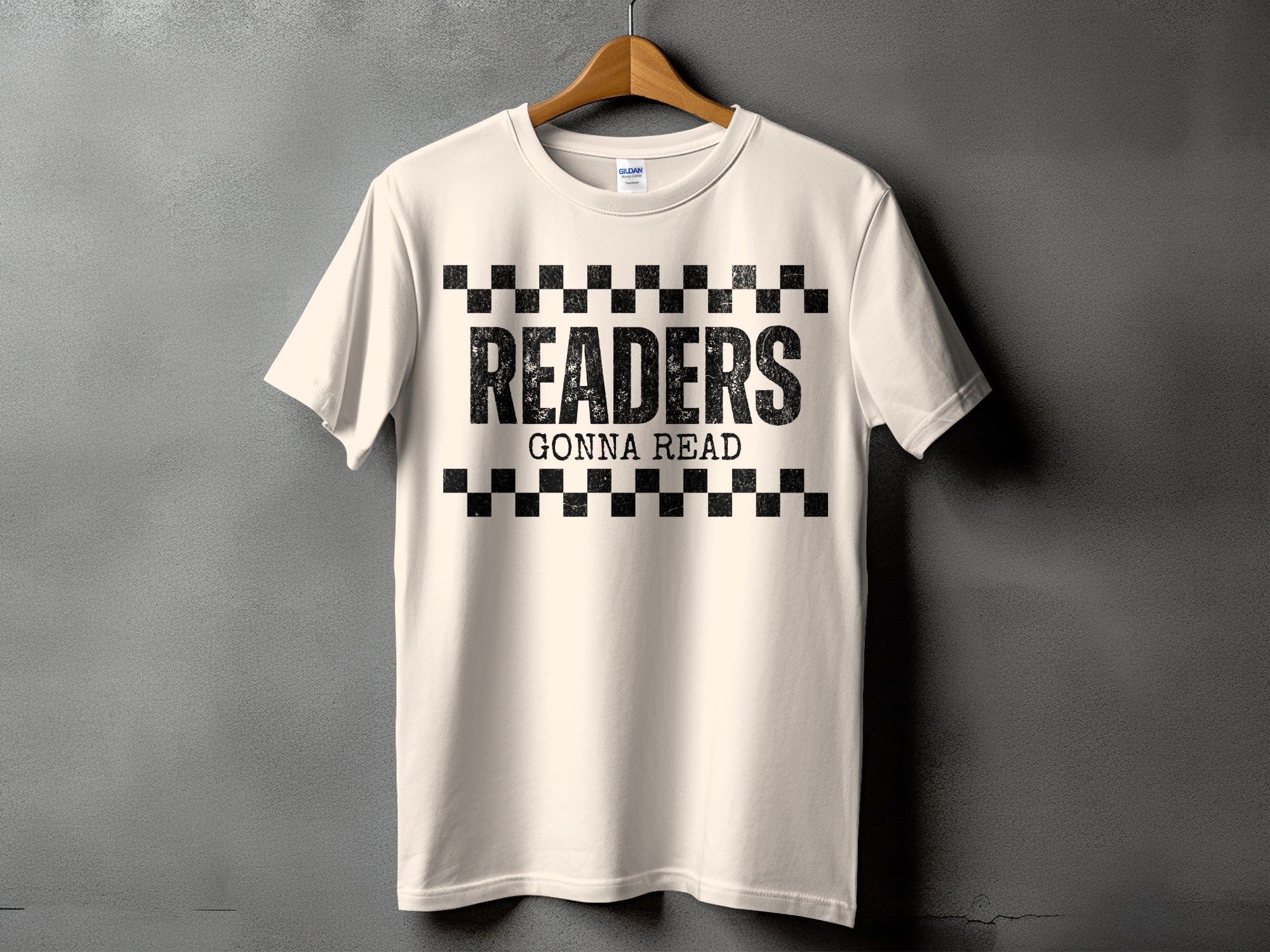 Cream t-shirt with "READERS GONNA READ" text and a checkered pattern.
