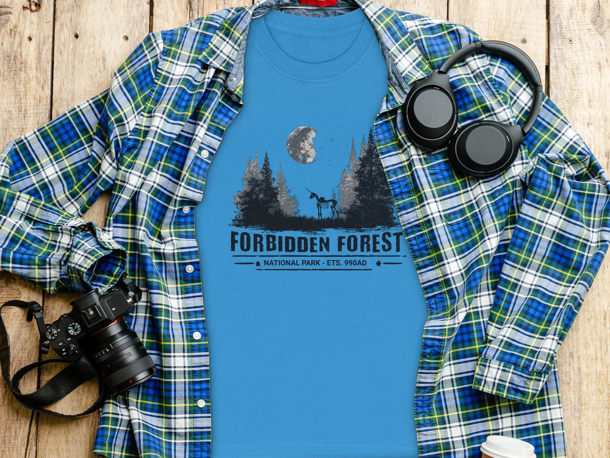 Blue t-shirt with "Forbidden Forest National Park" graphic and skeletal unicorn.