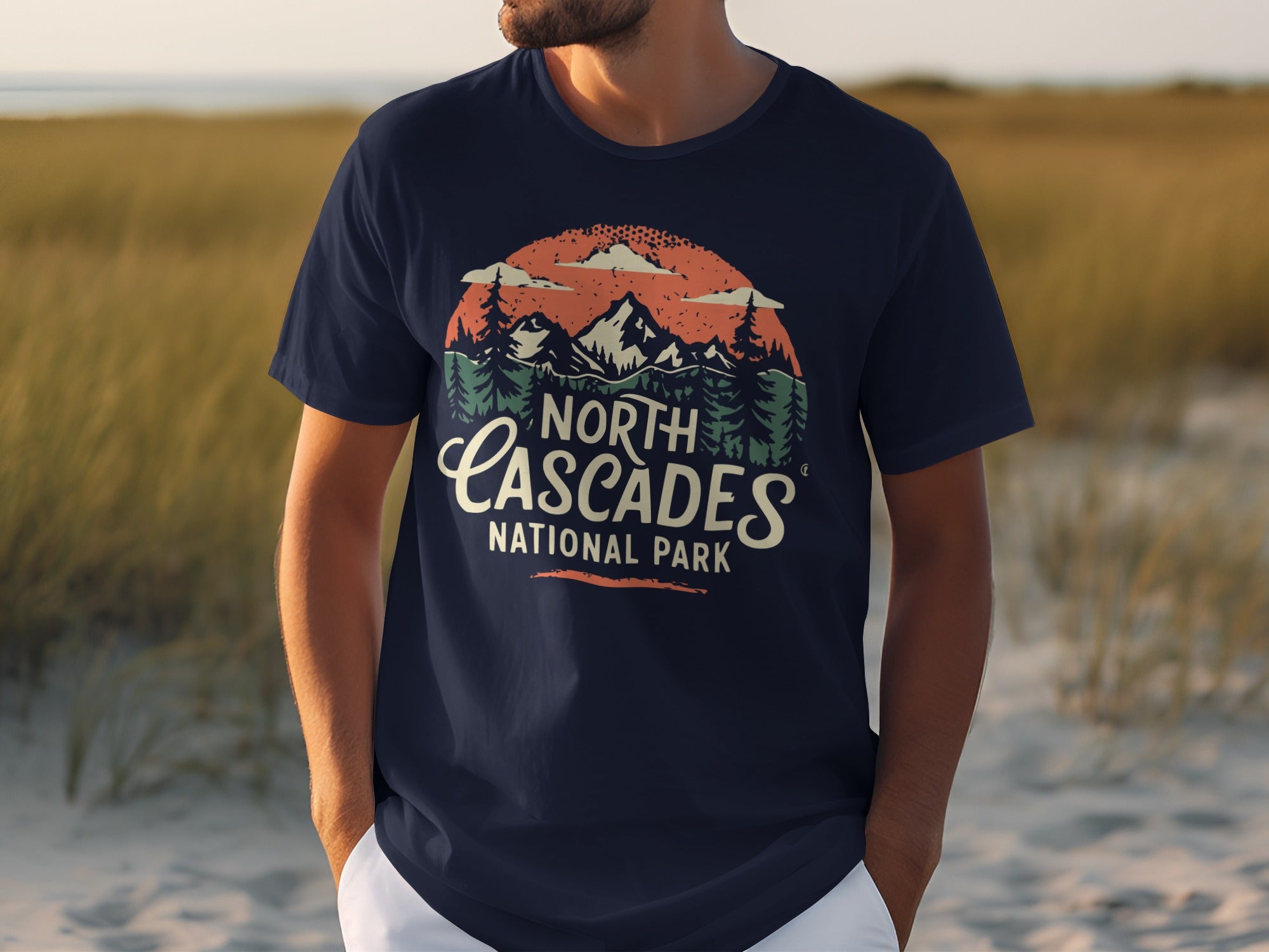Navy t-shirt with "North Cascades National Park" graphic featuring mountains and trees.