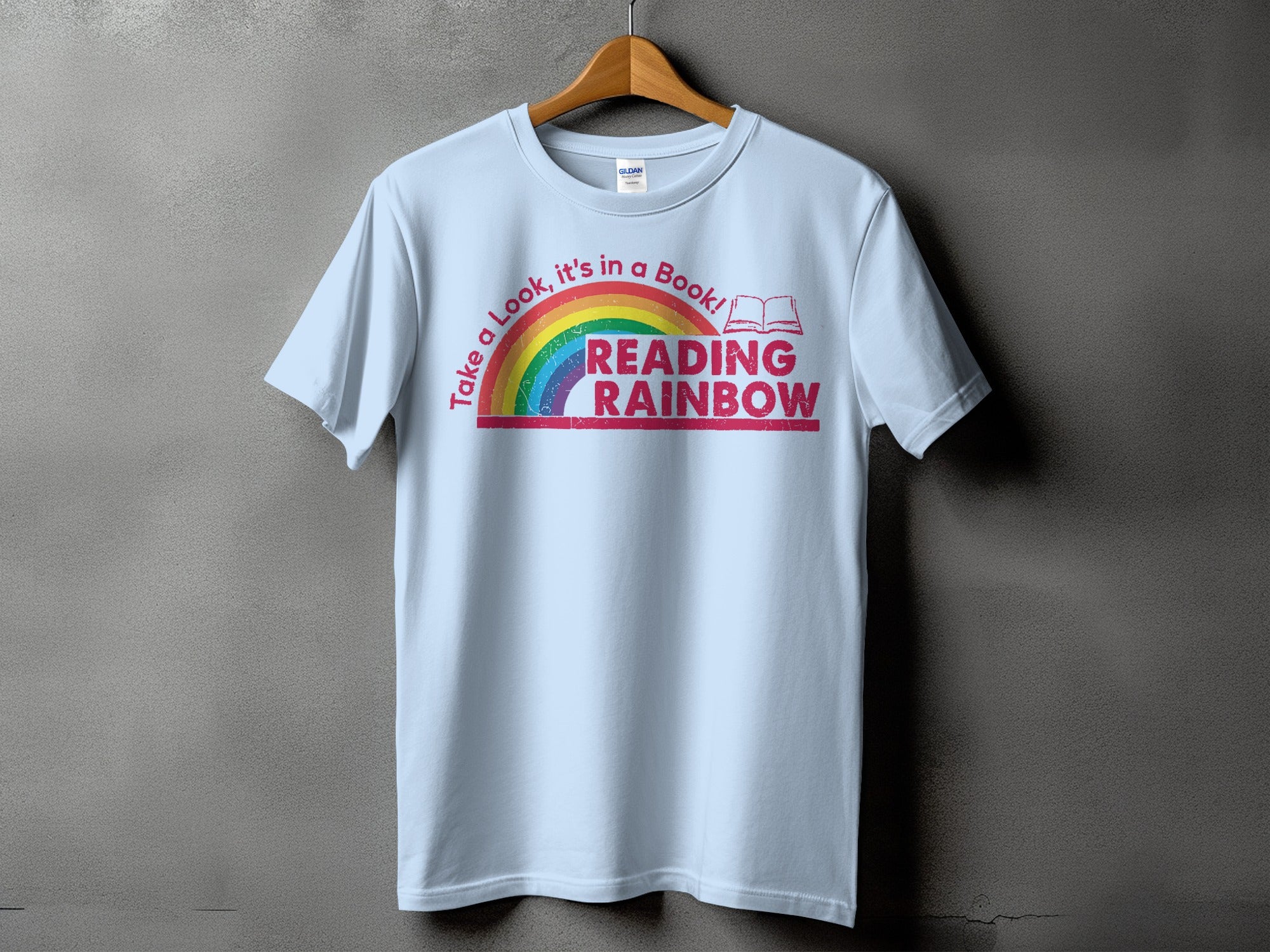 Light blue t-shirt with "Reading Rainbow" text and a rainbow graphic.
