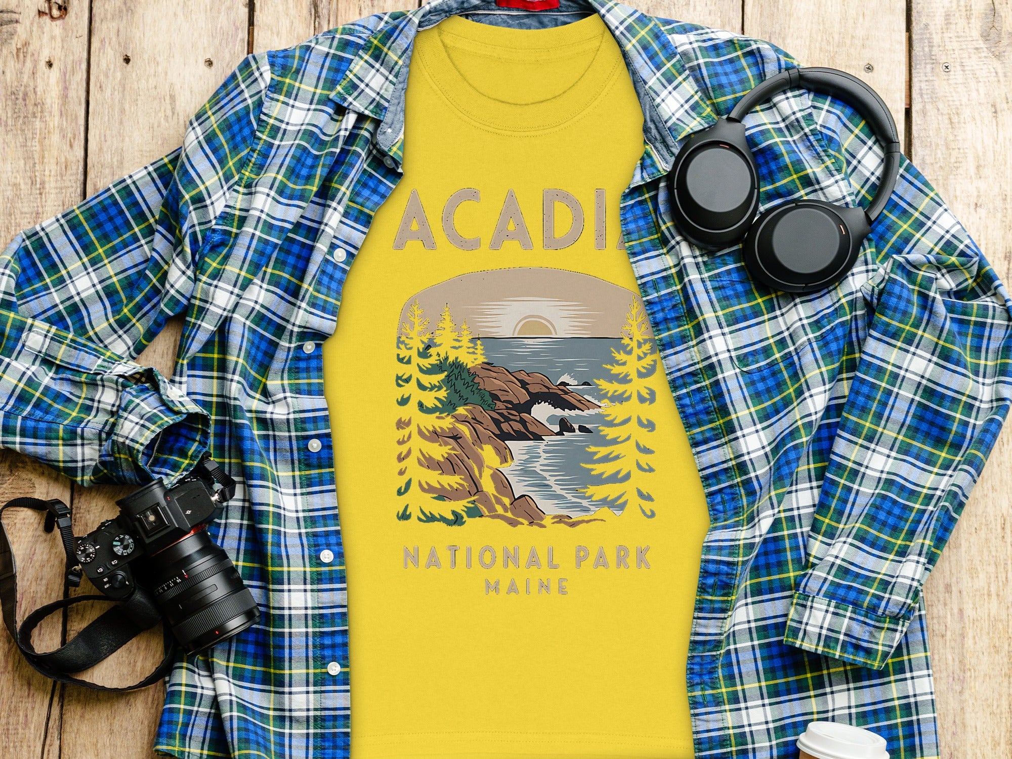 Yellow t-shirt with "Acadia National Park Maine" graphic and scenic illustration.