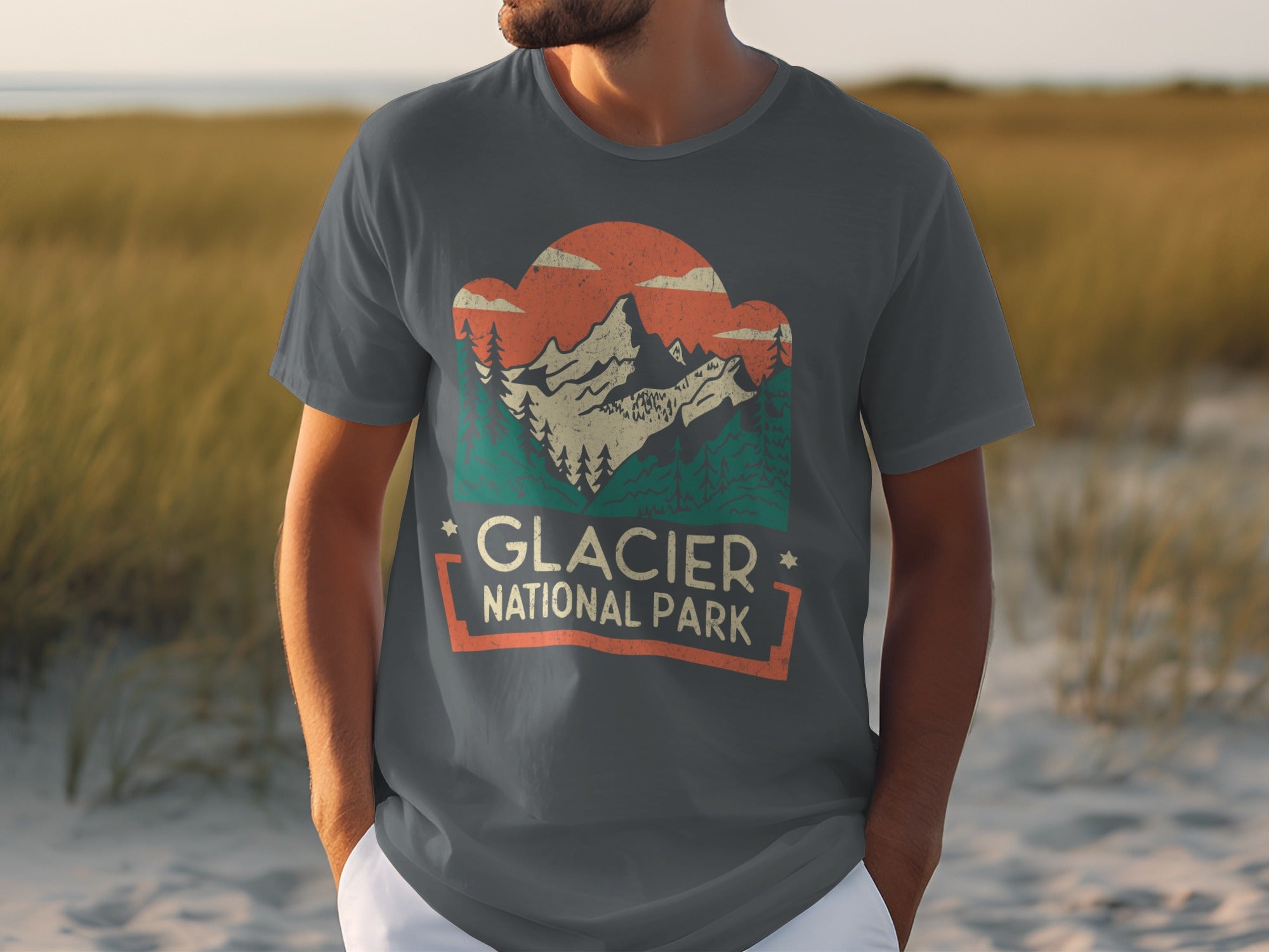 Dark gray t-shirt with retro Glacier National Park mountain graphic and text.