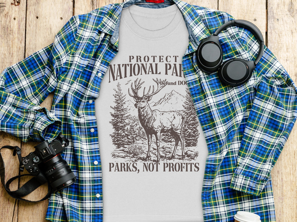 T-shirt with "Protect National Parks, Not Profits" text and deer graphic.