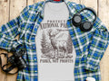 T-shirt with "Protect National Parks, Not Profits" text and deer graphic.