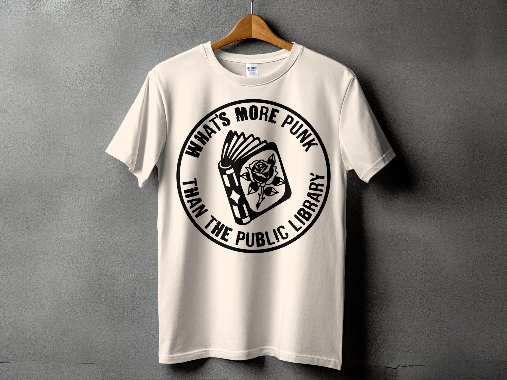 Cream t-shirt with black graphic: "What's More Punk Than The Public Library".