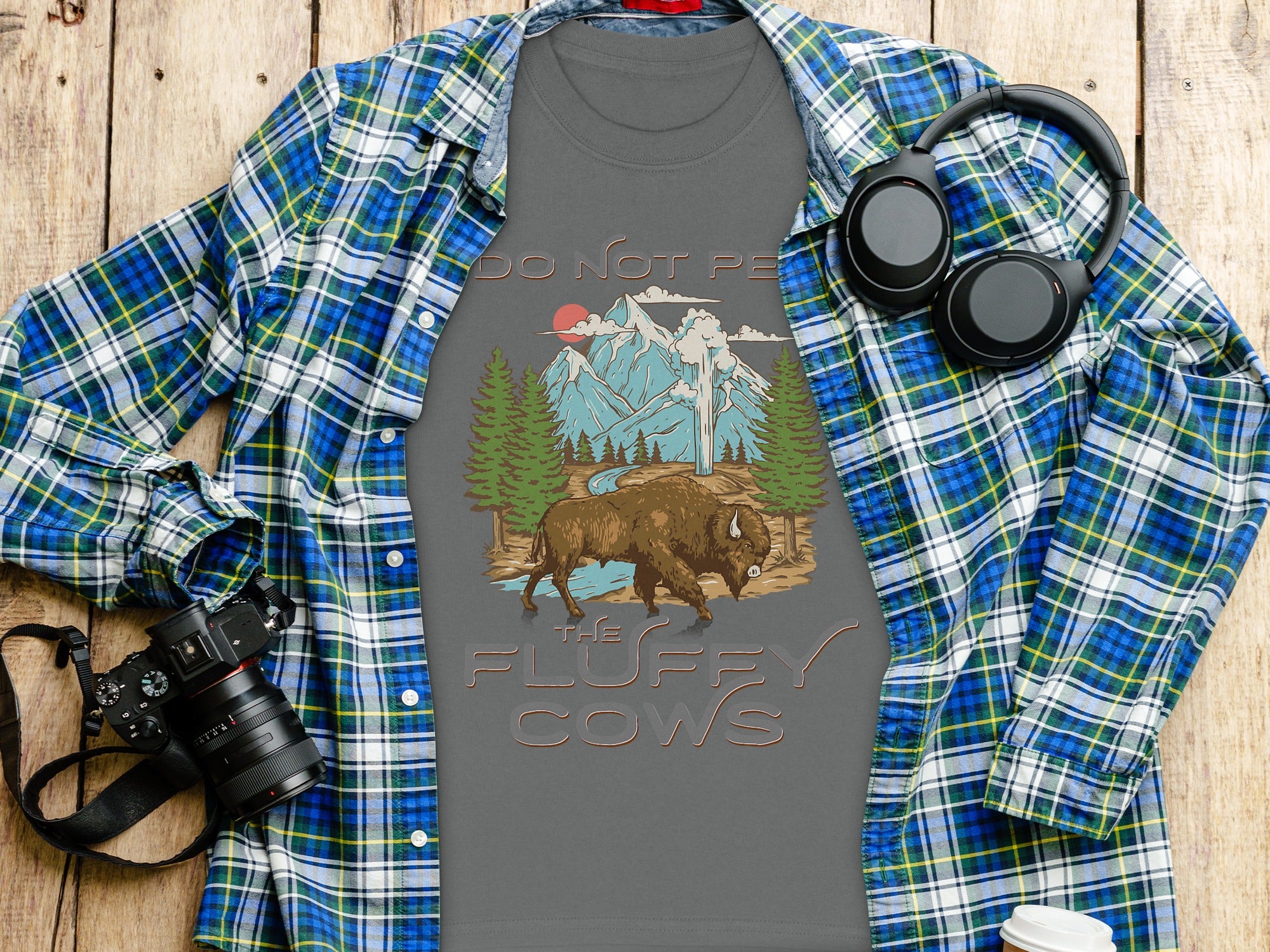 T-shirt with "DO NOT PE" and "THE FLUFFY COWS" text, featuring bison and mountain graphic.