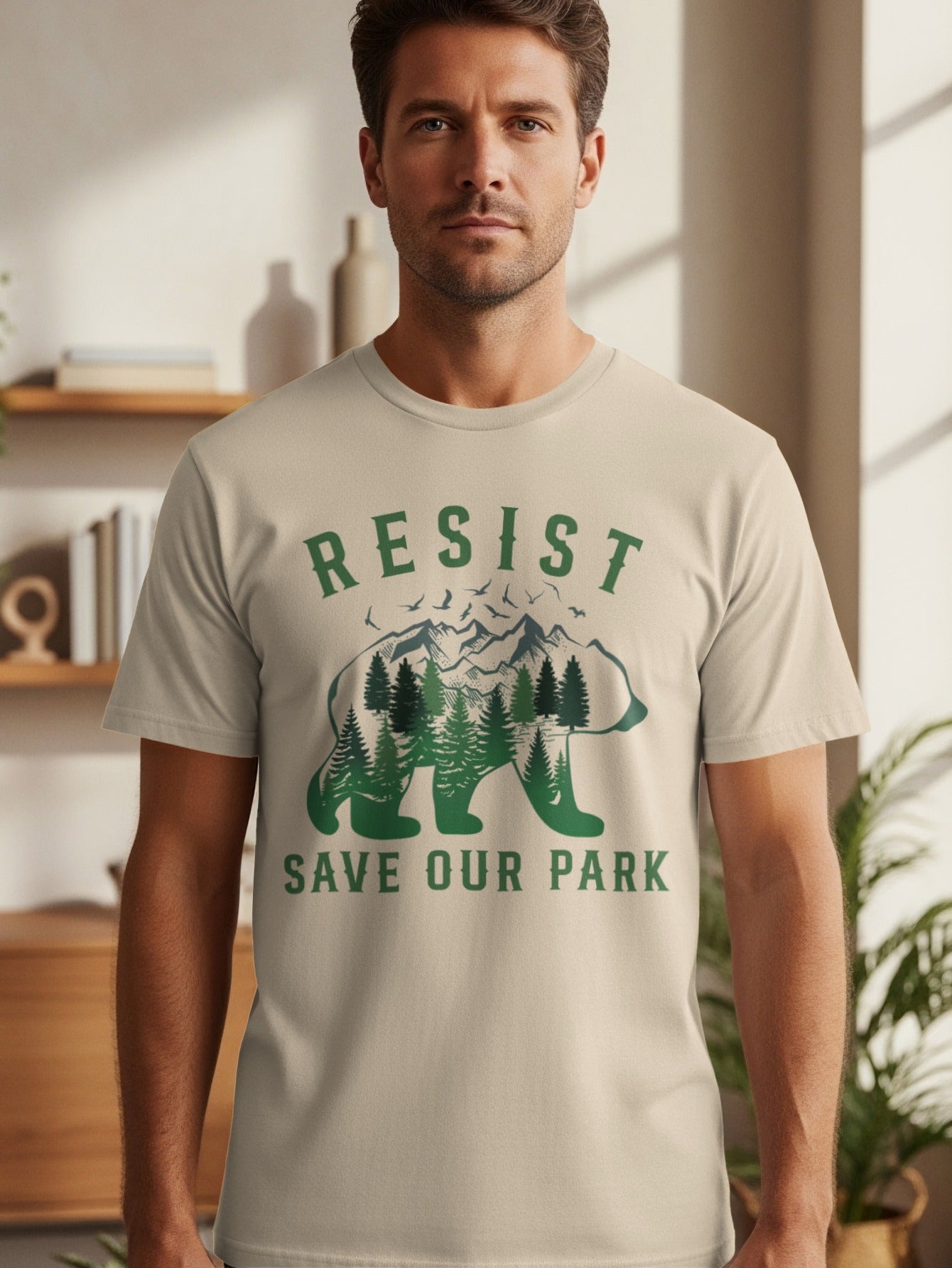 T-shirt with "RESIST SAVE OUR PARK" text and a bear filled with trees and mountains.