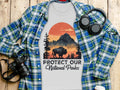 T-shirt with bison, mountains, and trees graphic. Text reads "Protect Our National Parks."