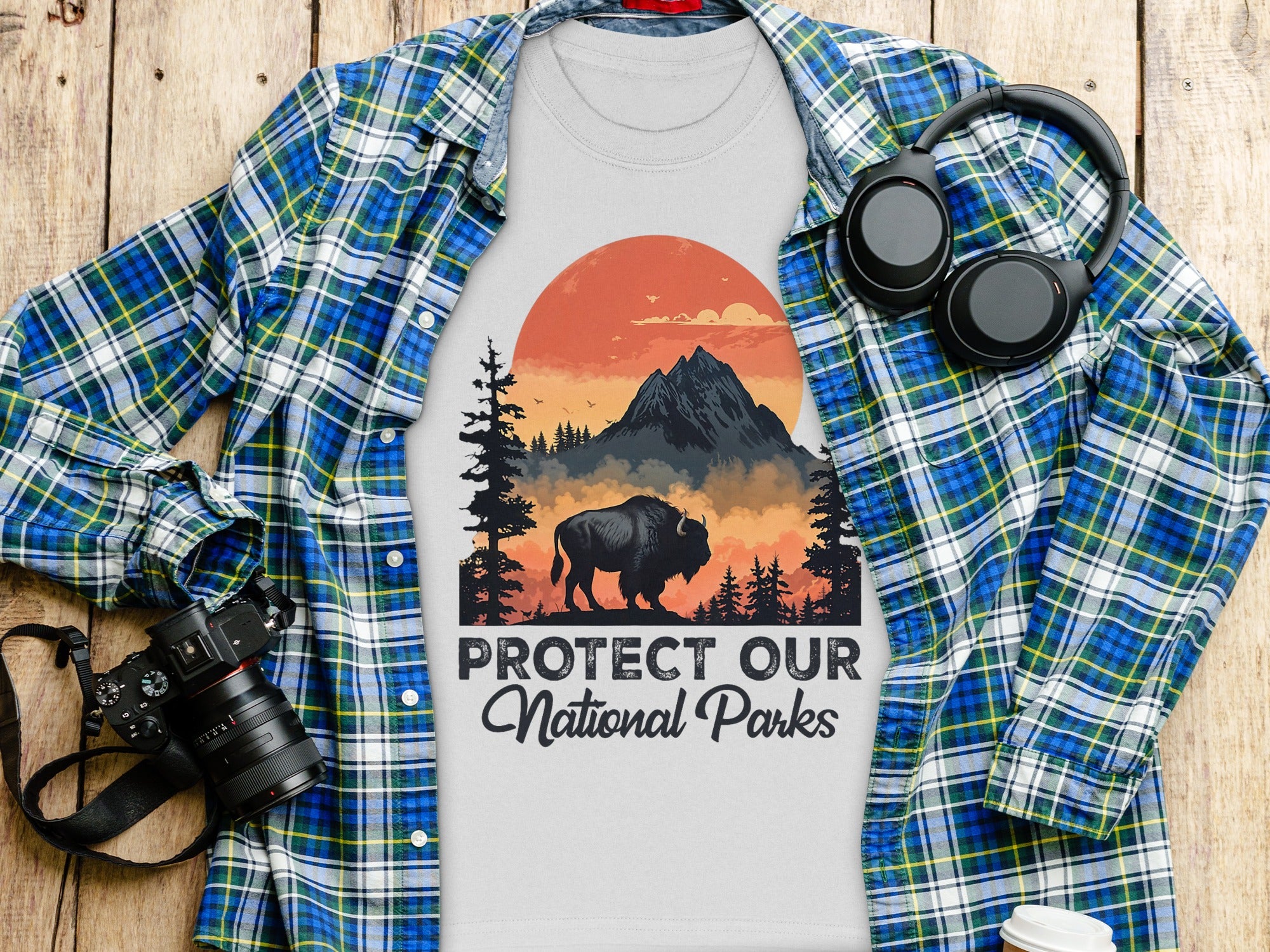 T-shirt with bison, mountains, and trees graphic. Text reads "Protect Our National Parks."