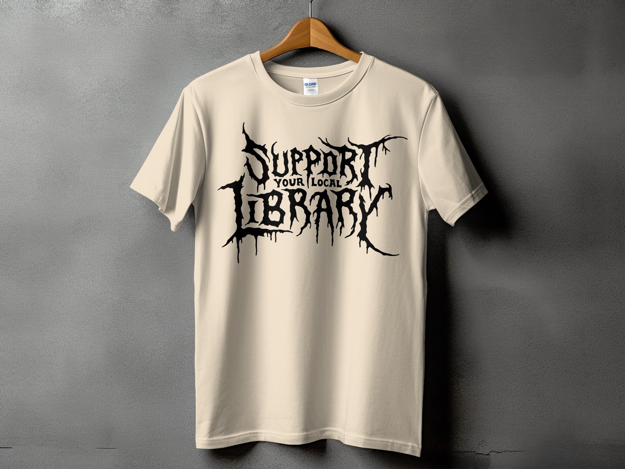 Light yellow t-shirt with black "Support Your Local Library" text in distressed font.