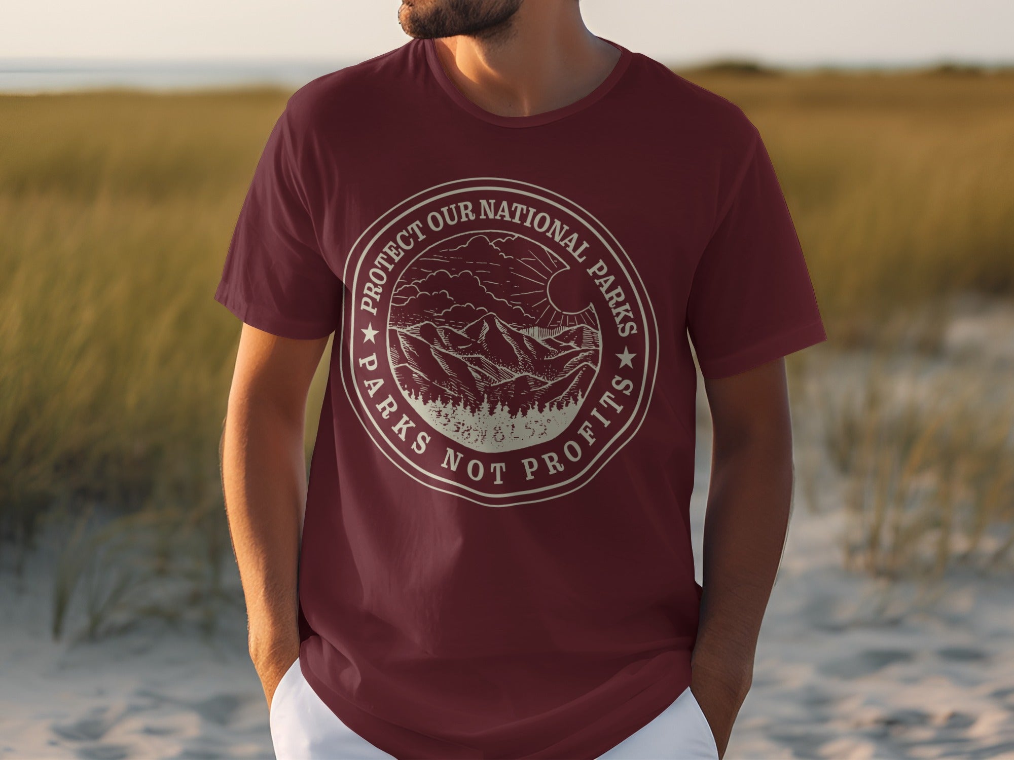 Maroon t-shirt with circular graphic: "Protect Our National Parks Parks Not Profits"