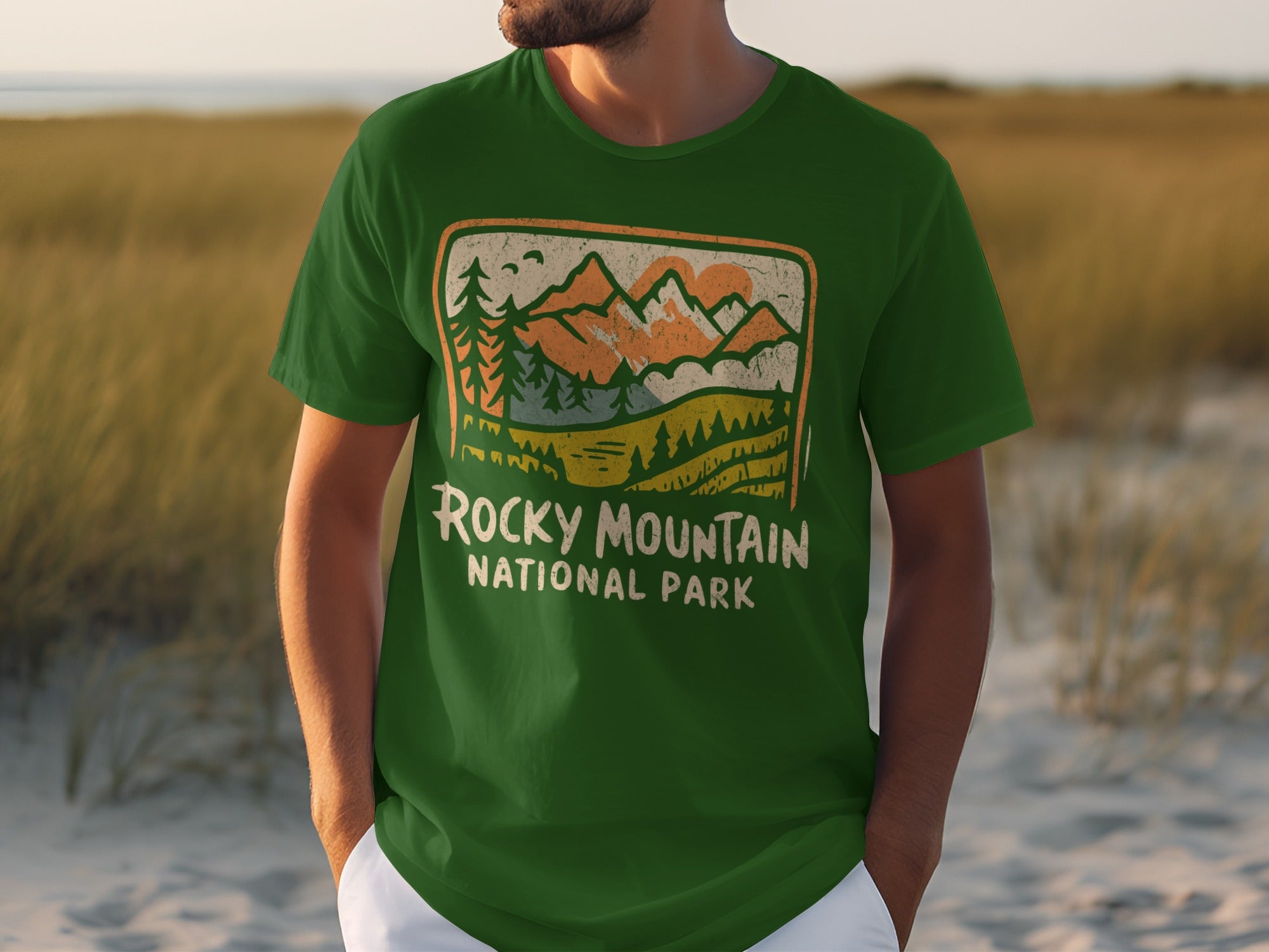Green t-shirt with Rocky Mountain National Park graphic featuring mountains and trees.
