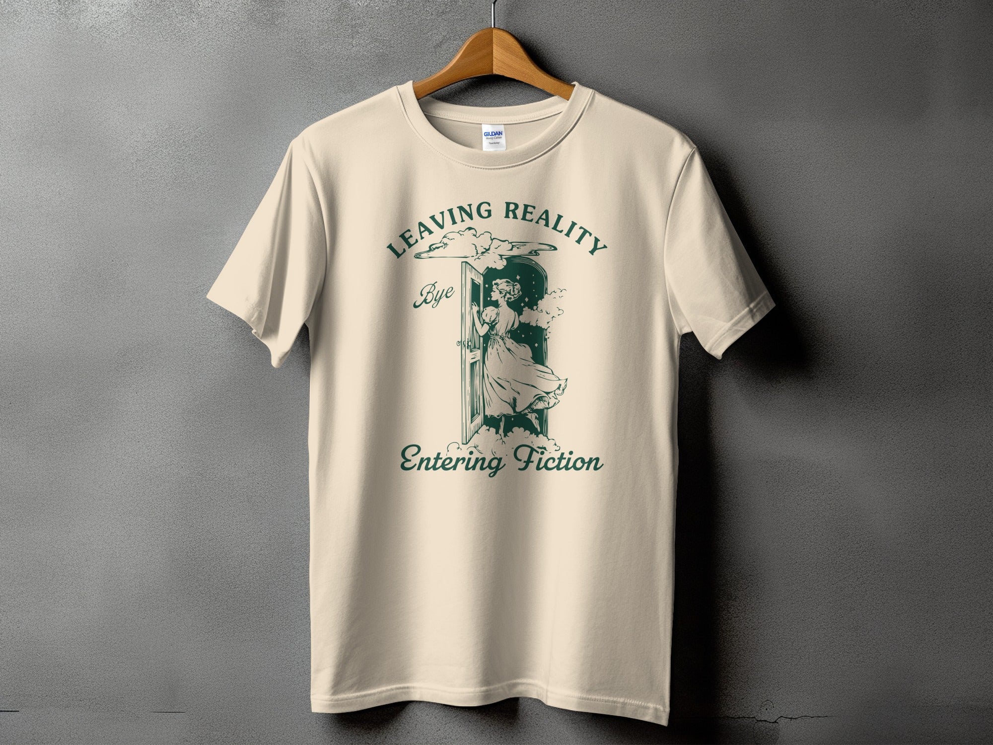 Light-colored t-shirt with green text and illustration of a woman stepping through a doorway.