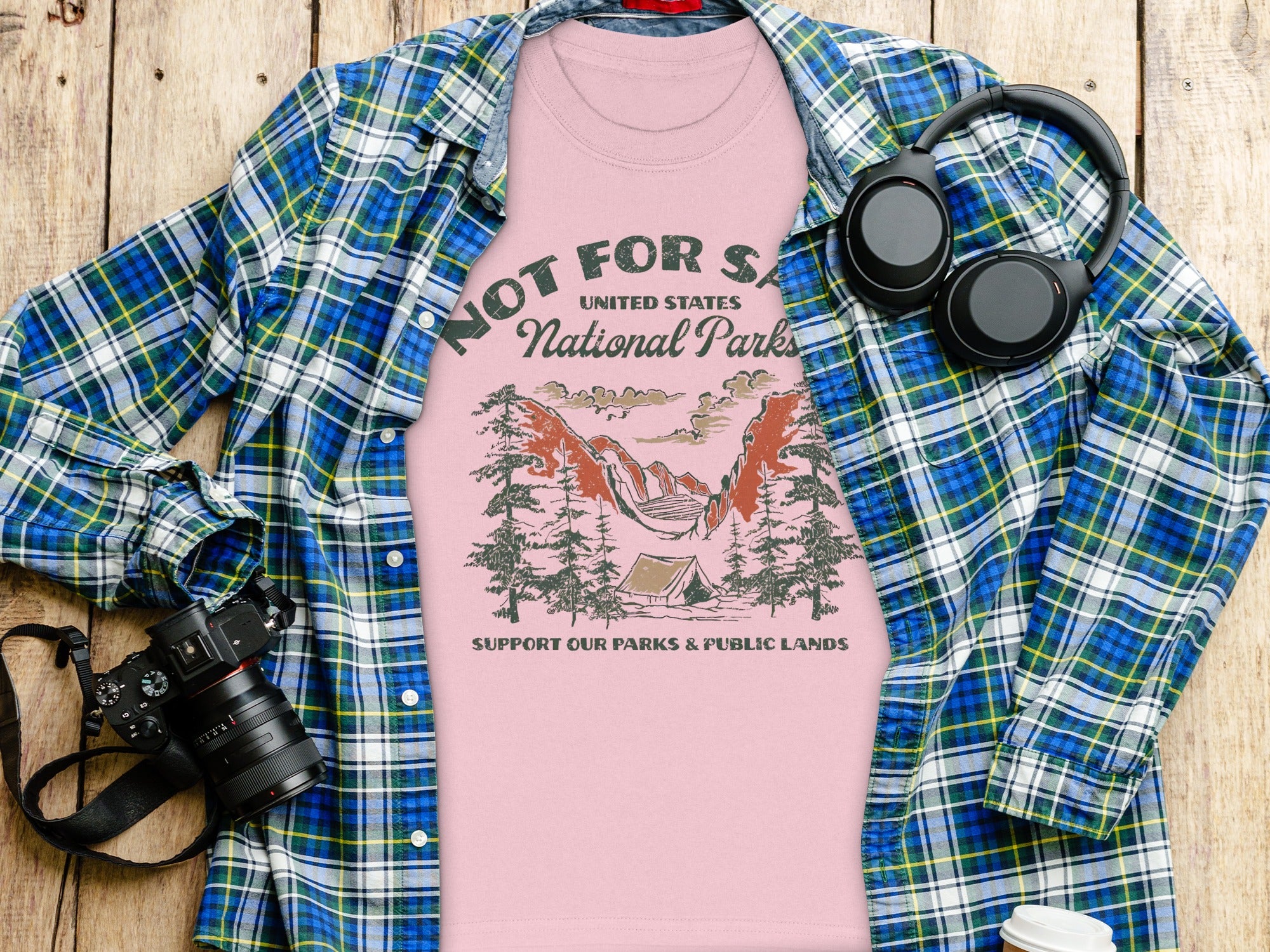 Pink t-shirt with "Not For Sale United States National Parks" graphic and camping scene.